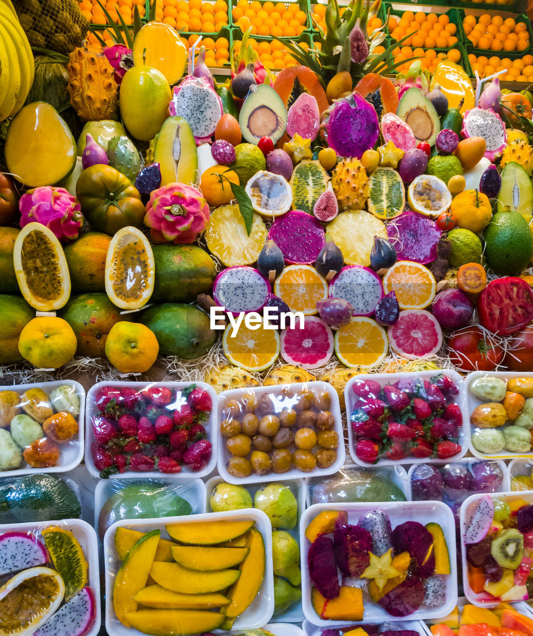 HIGH ANGLE VIEW OF MULTI COLORED FRUITS IN MARKET