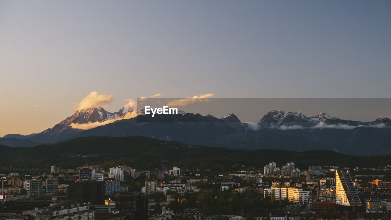 Triglav and julian alps in the background from ljubljana castle at sunset, slovenia.