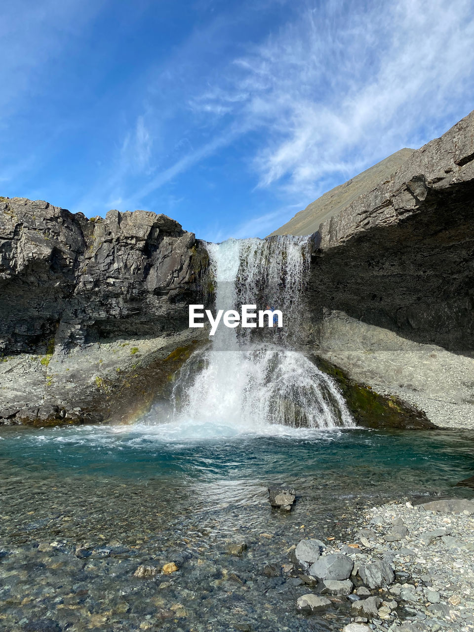 water, waterfall, scenics - nature, beauty in nature, body of water, motion, nature, rock, environment, sea, sky, cloud, long exposure, water feature, land, landscape, cliff, blue, coast, travel destinations, no people, power in nature, mountain, terrain, splashing, non-urban scene, outdoors, flowing water, rock formation, travel, day, wave, flowing, blurred motion, geology, sports, idyllic, tourism