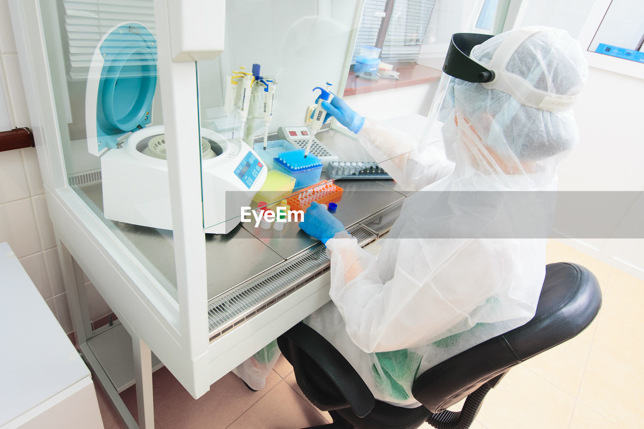 high angle view of woman with iv drip at clinic