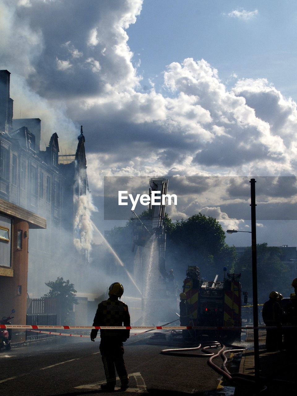 Water being sprayed on building during fire