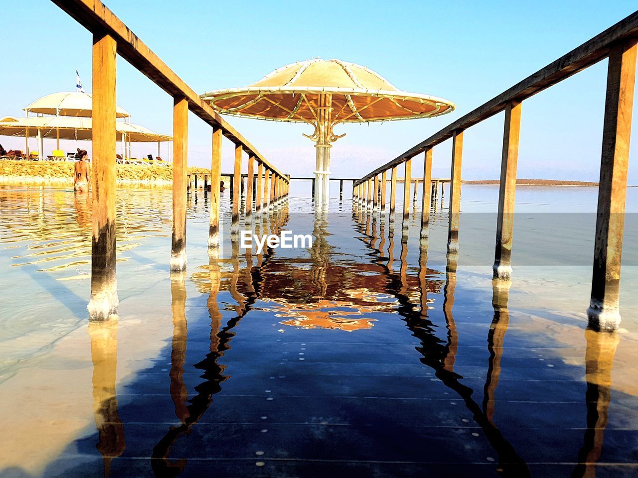 GAZEBO ON BEACH AGAINST SKY