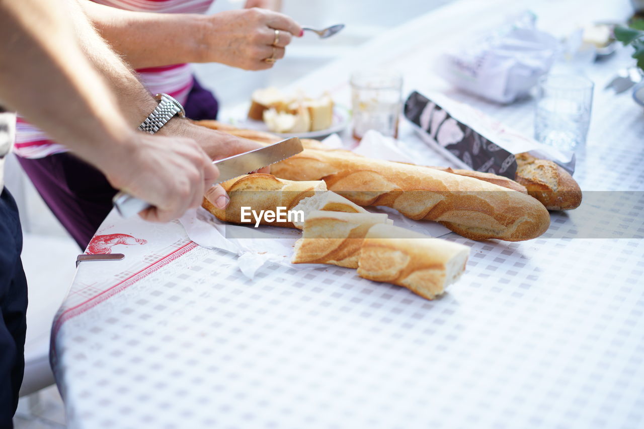 Cropped image of hands preparing food