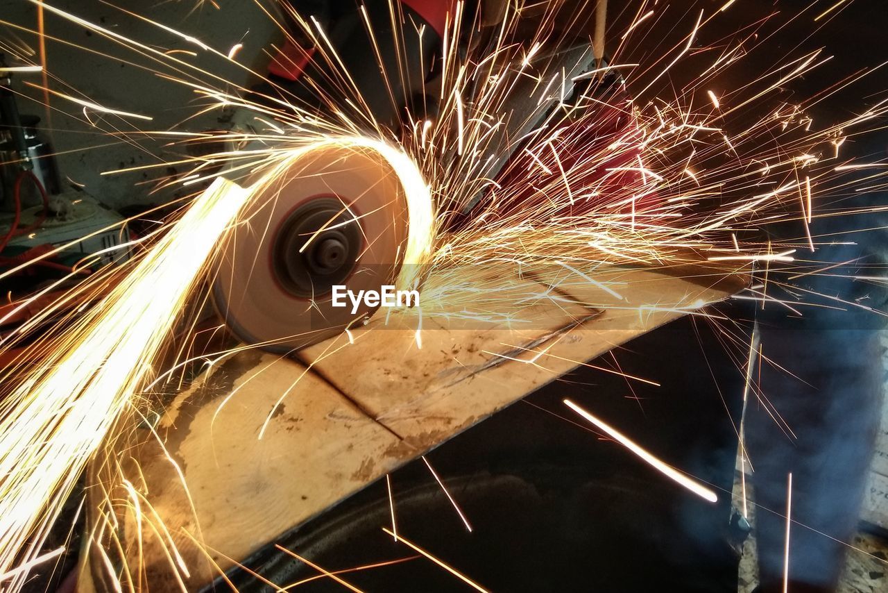 Close-up of sparks flying from grinder