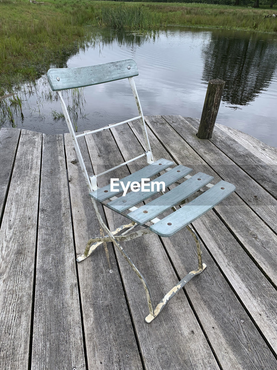 HIGH ANGLE VIEW OF PIER AND LAKE