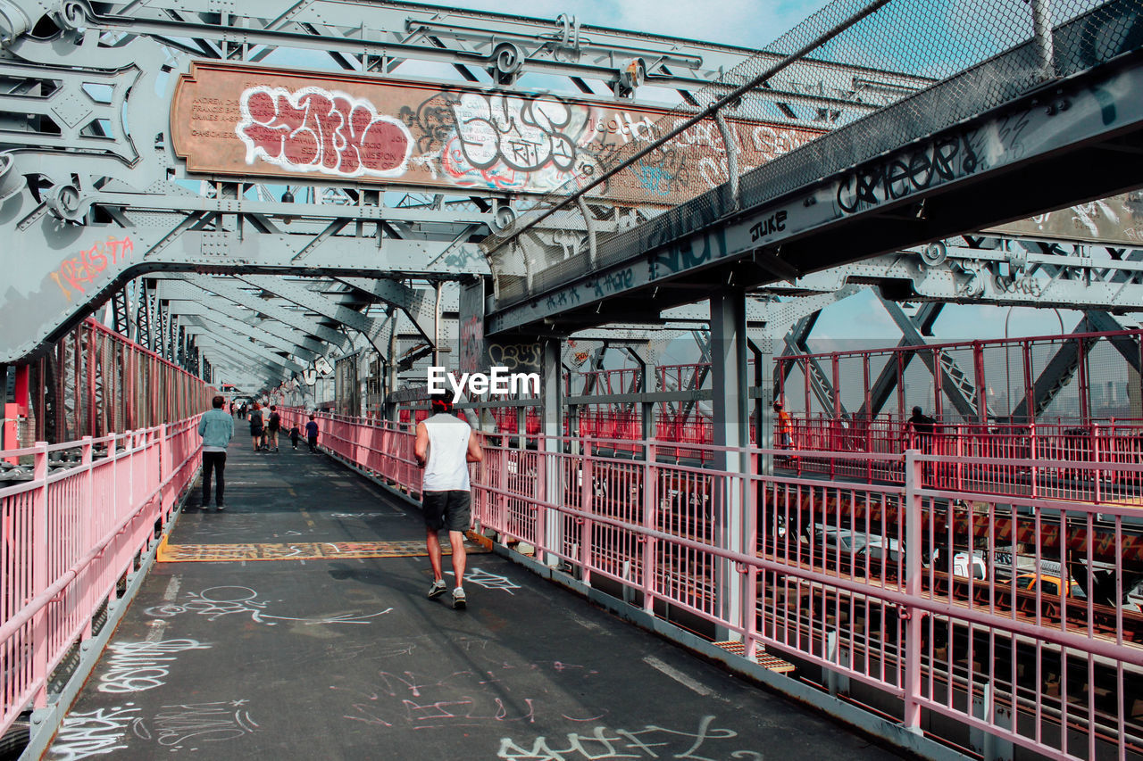 People walking on footbridge