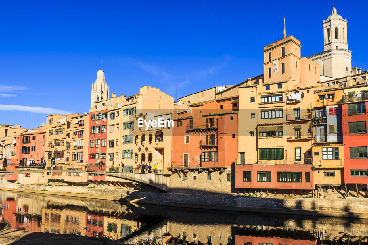 BUILDINGS AGAINST BLUE SKY