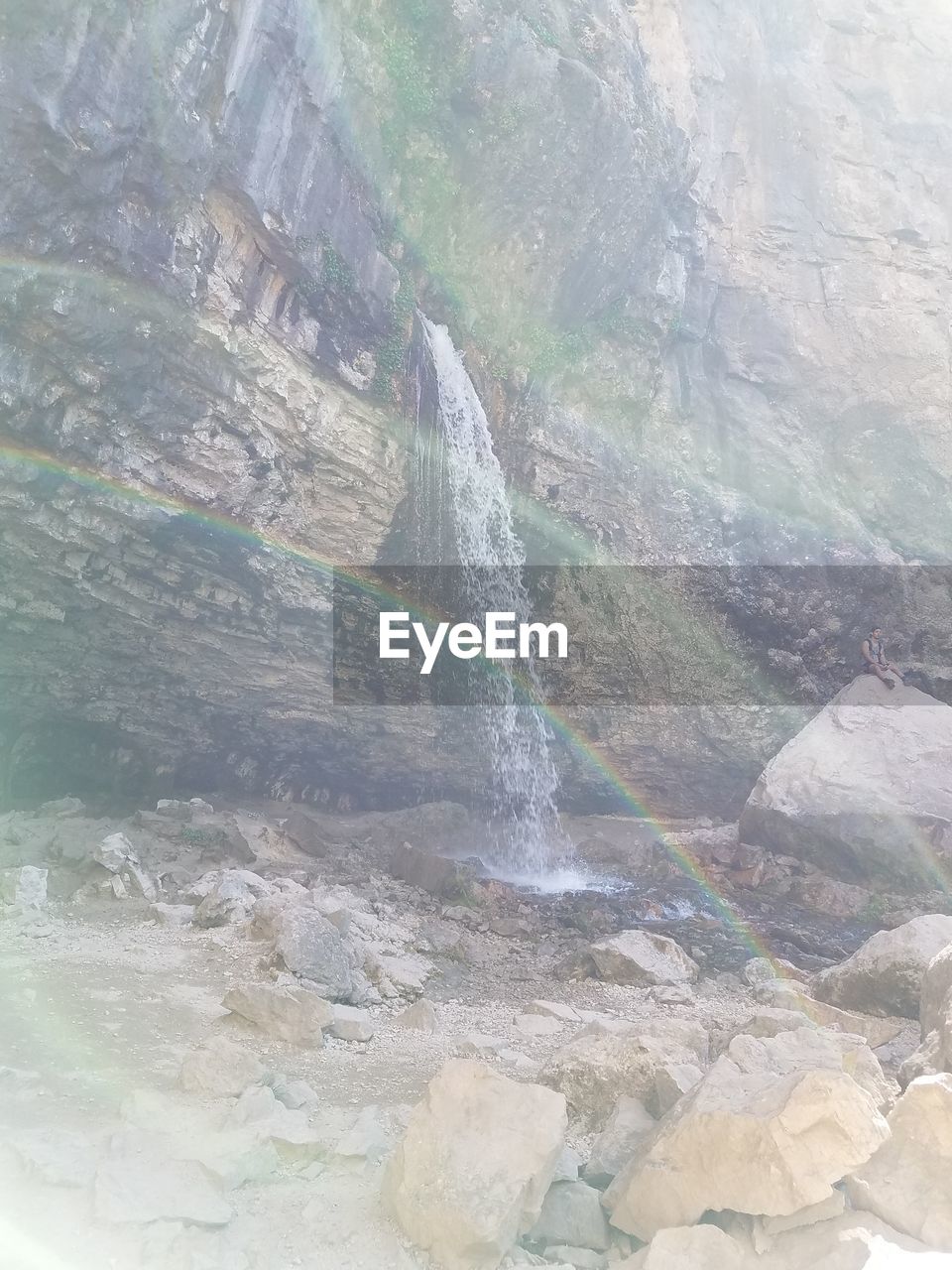 HIGH ANGLE VIEW OF ROCK FORMATION AT SHORE