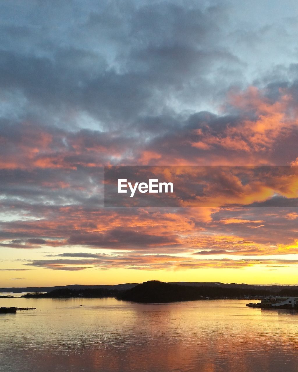 Scenic view of sea at sunset