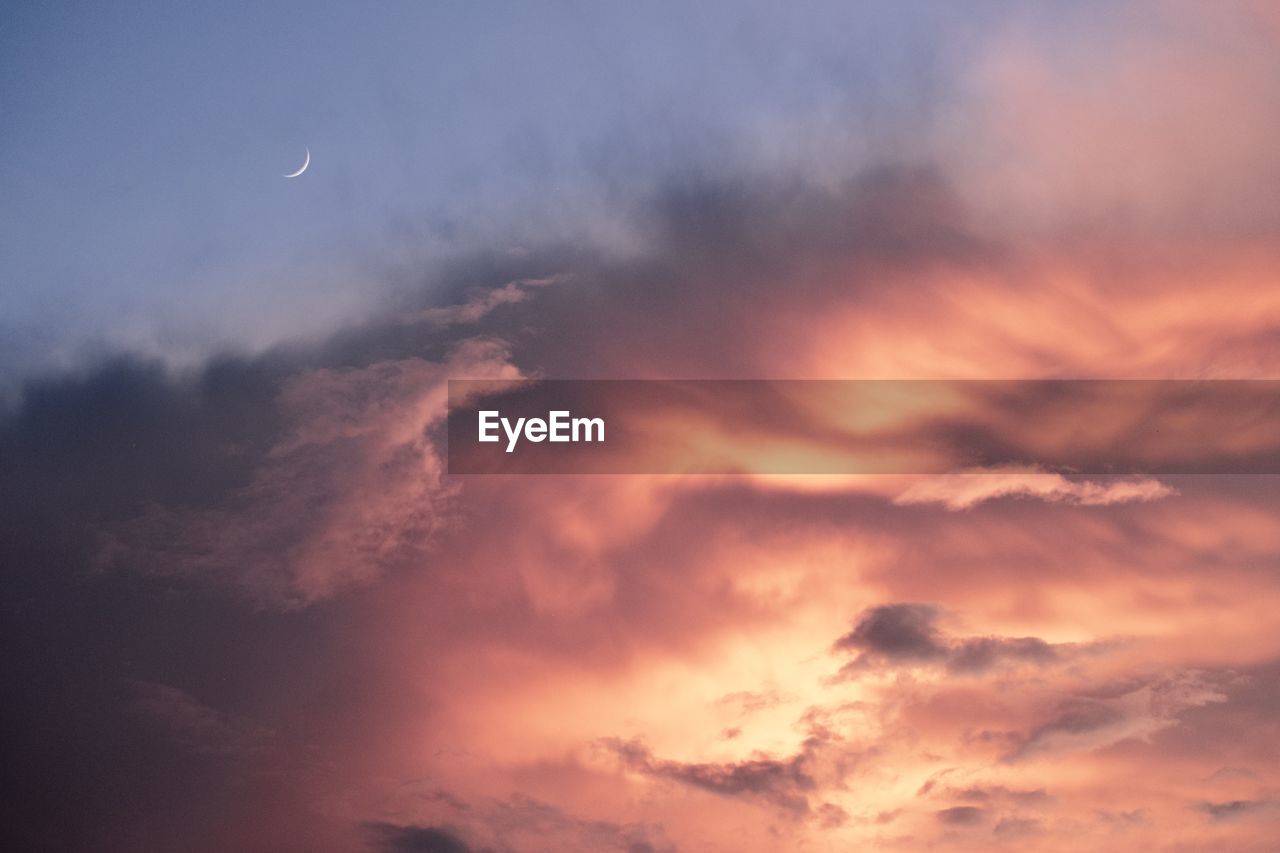 Low angle view of dramatic sky during sunset