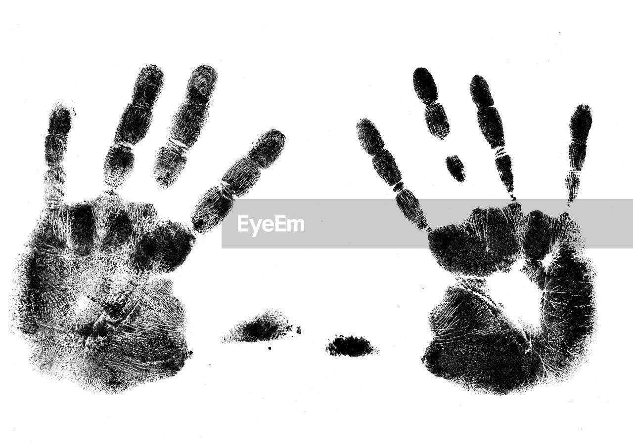Close-up of handprints on white background