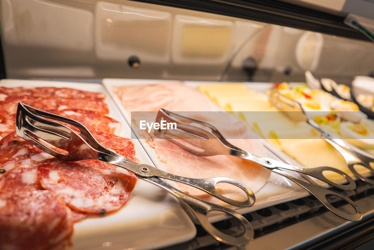 food, food and drink, meal, indoors, freshness, kitchen, meat, cooking, buffet, appliance, no people, dish, kitchen utensil, household equipment, close-up, cuisine, brunch, breakfast, domestic room, restaurant, healthy eating, seafood, selective focus, business, domestic kitchen