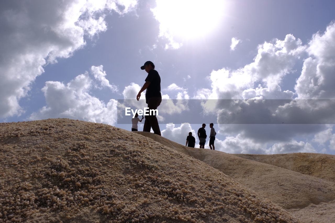 PEOPLE ON ARID LANDSCAPE