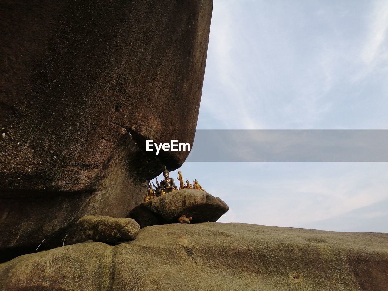 Low angle view of rock formations against sky