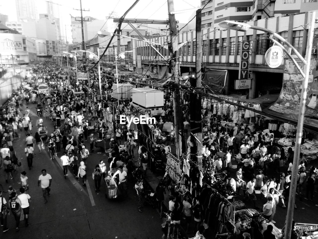 HIGH ANGLE VIEW OF CROWD ON CITY STREET