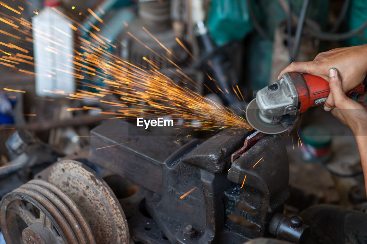 Midsection of man working at factory