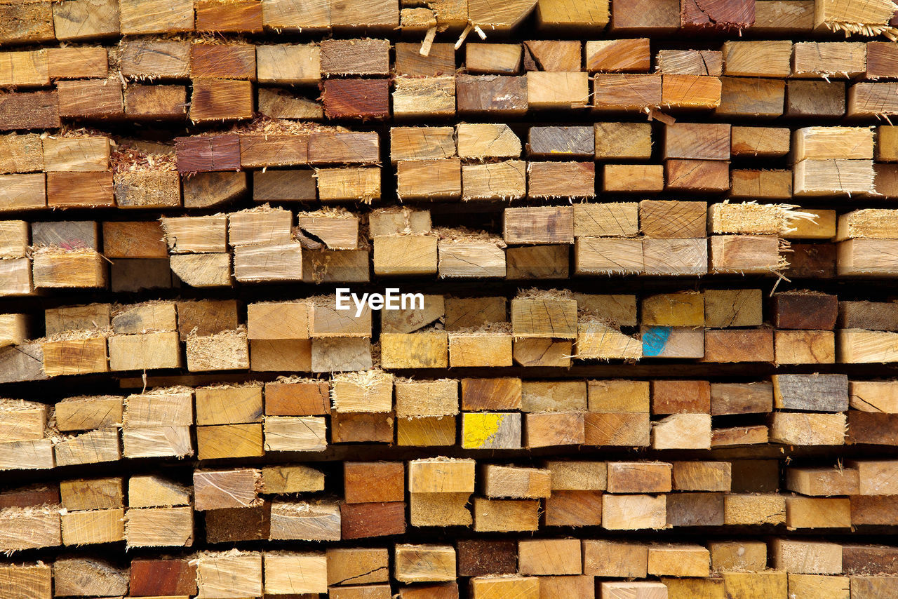 FULL FRAME SHOT OF FIREWOOD STACK