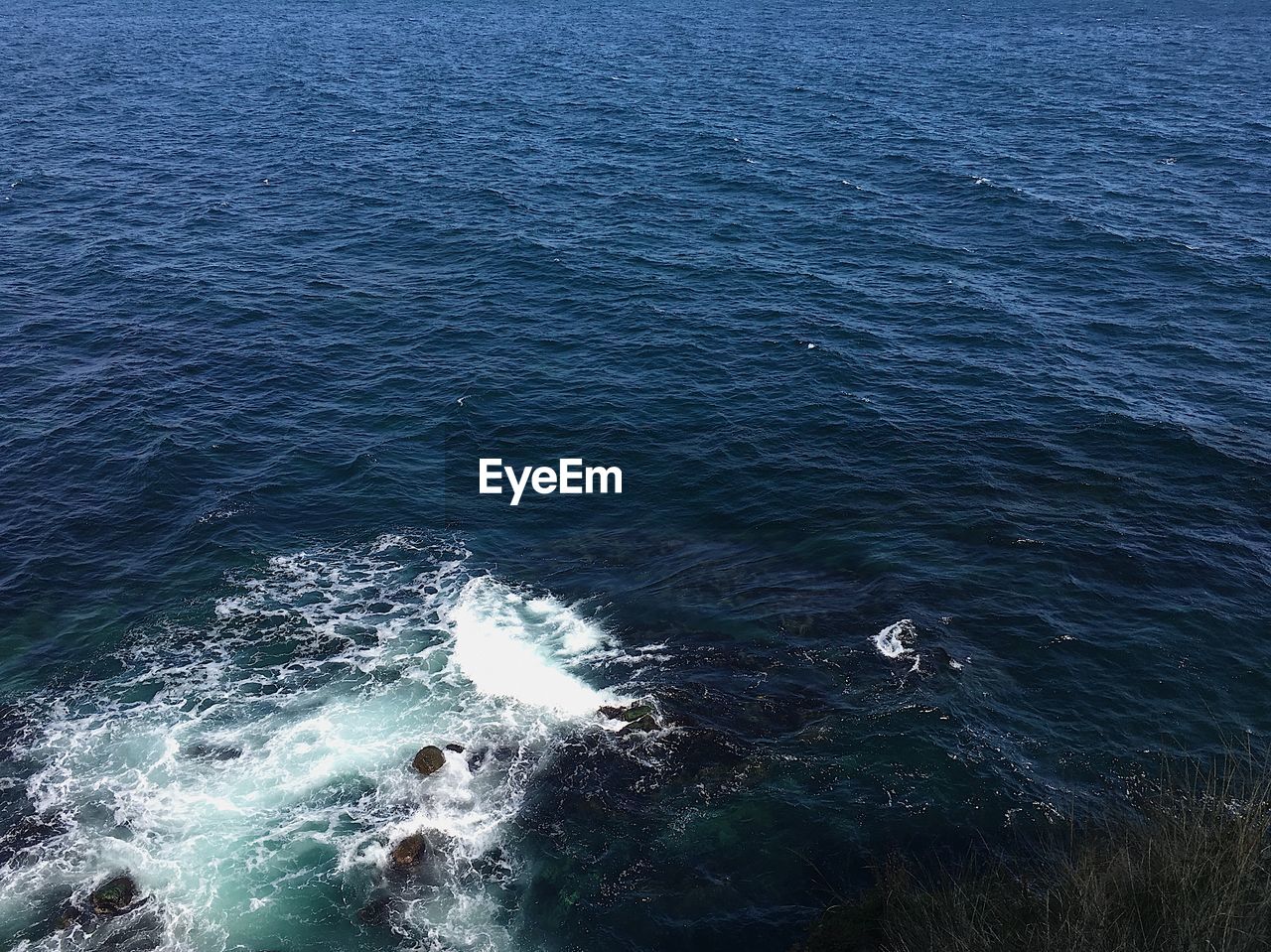 HIGH ANGLE VIEW OF SEA AND ROCKS