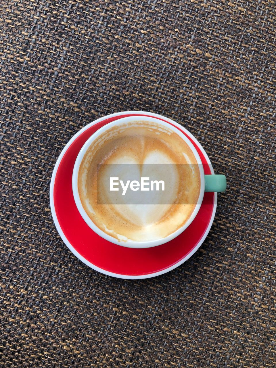 CLOSE-UP OF CAPPUCCINO ON TABLE