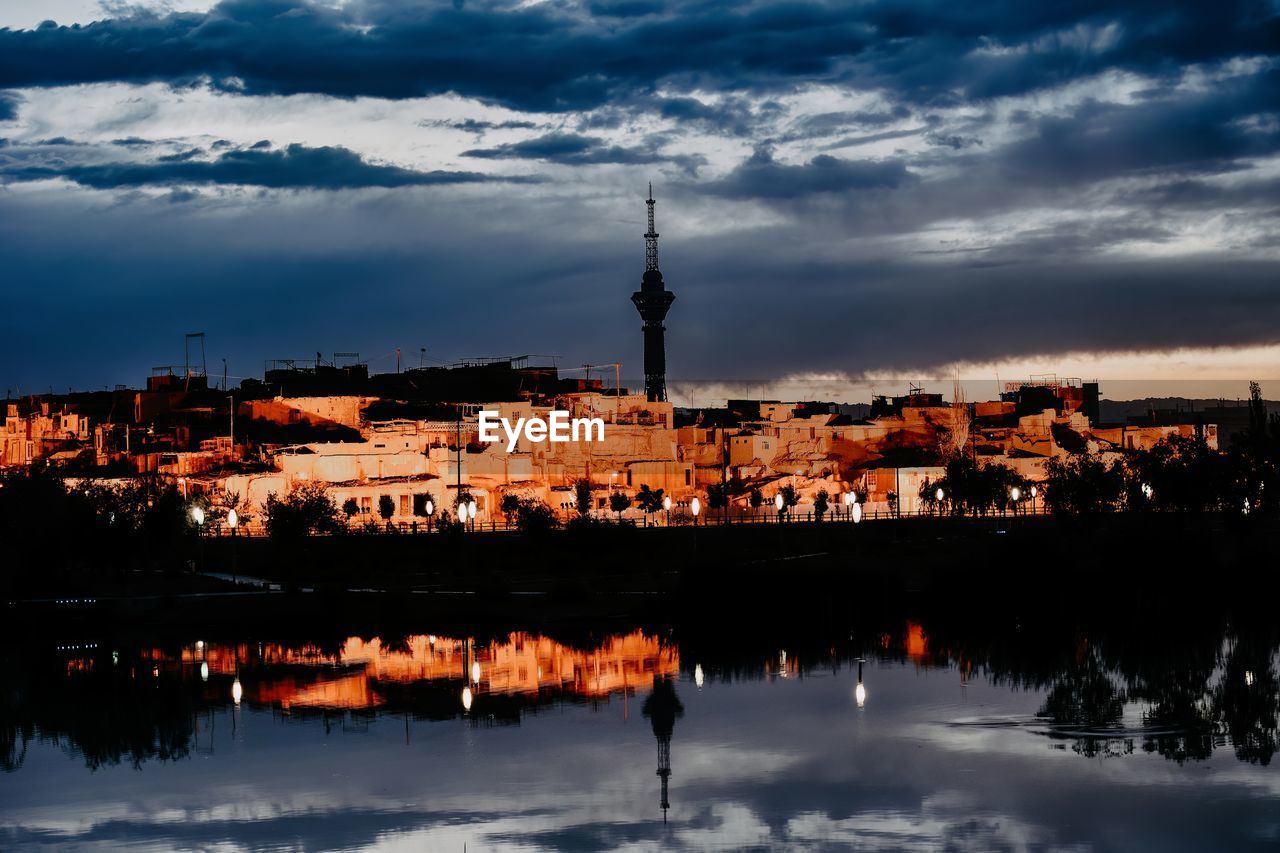 reflection, architecture, sky, cloud, built structure, evening, building exterior, dusk, water, sunset, cityscape, city, building, nature, travel destinations, horizon, skyline, tower, religion, no people, night, travel, place of worship, outdoors, tourism, landscape, town, sea, history, nautical vessel, the past, communications tower