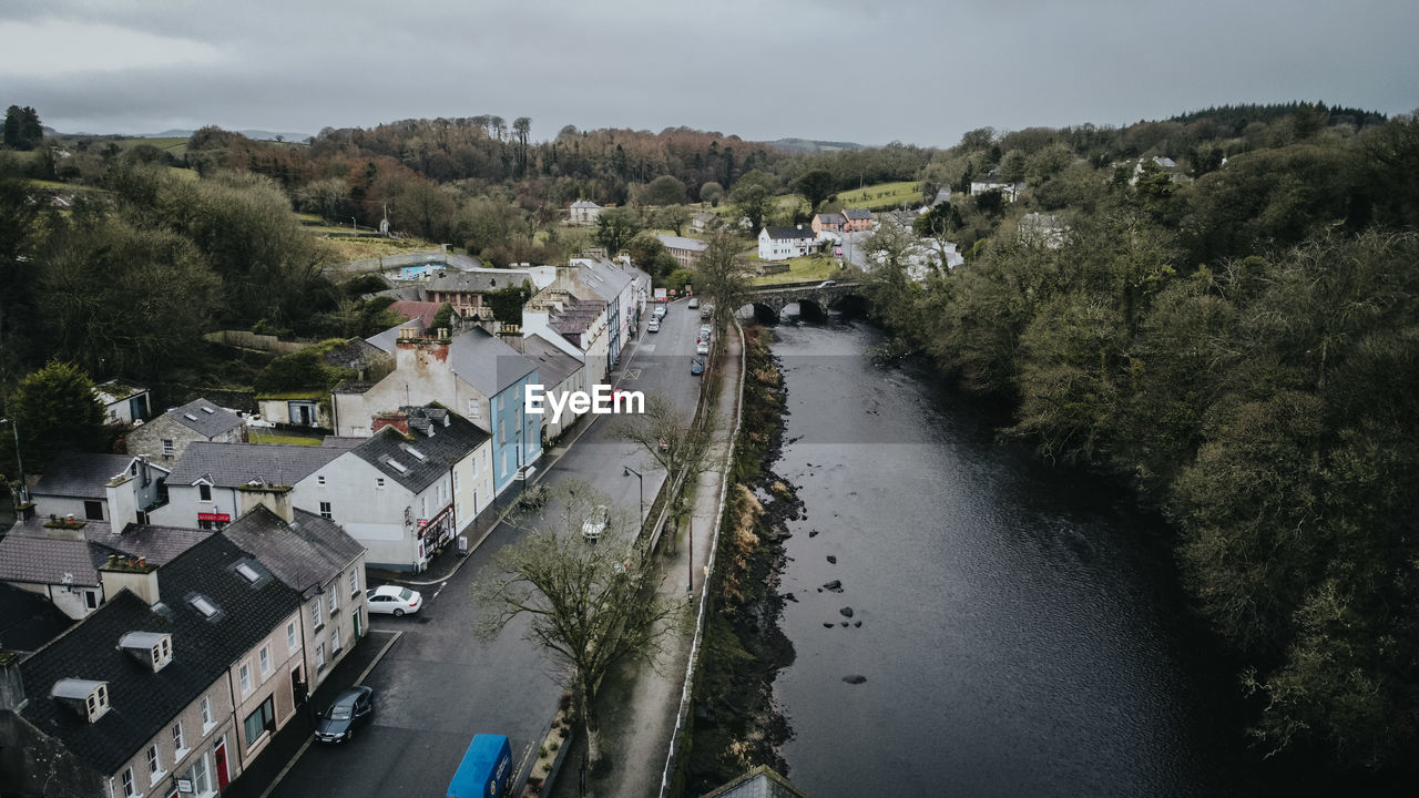 High angle view of river by city against sky