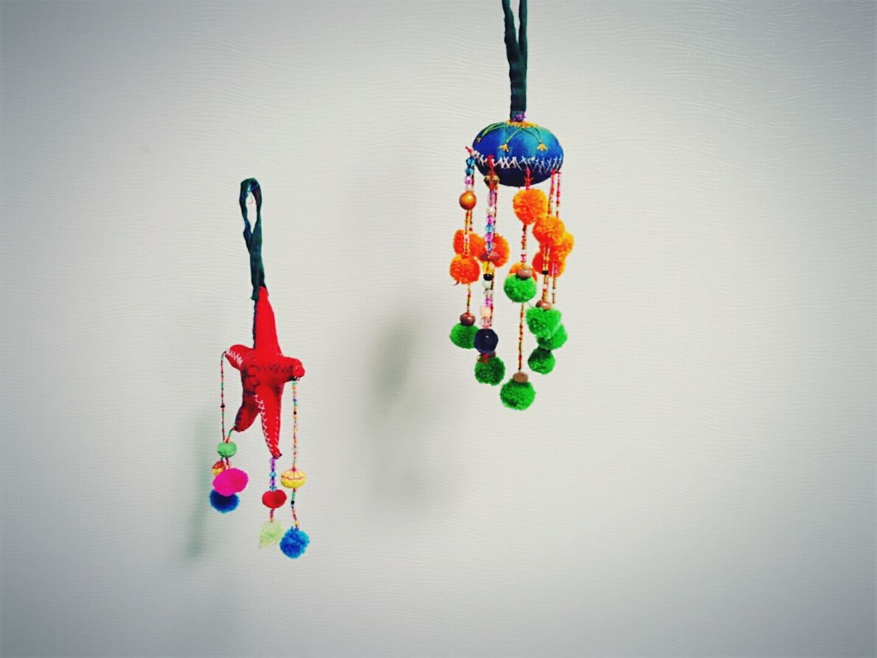 CLOSE-UP OF MULTI COLORED OBJECTS ON WHITE BACKGROUND