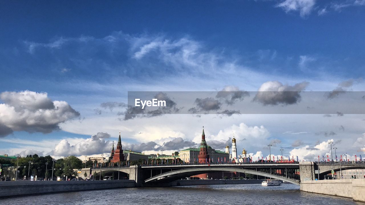 View of bridge over river against cloudy sky