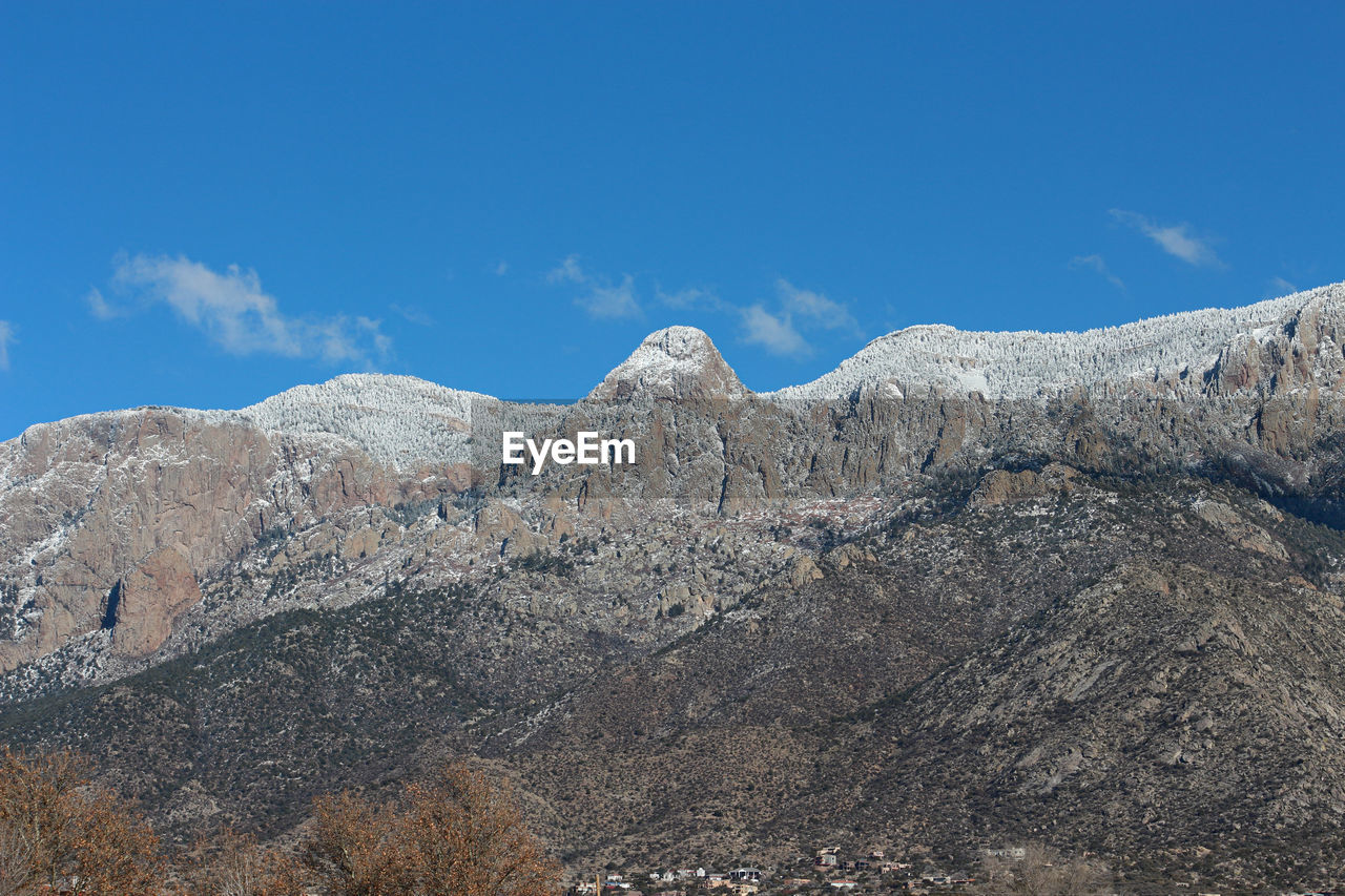 Low angle view of rock formation against sky