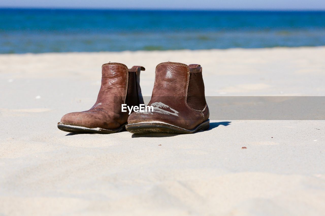 Leather boots on beach