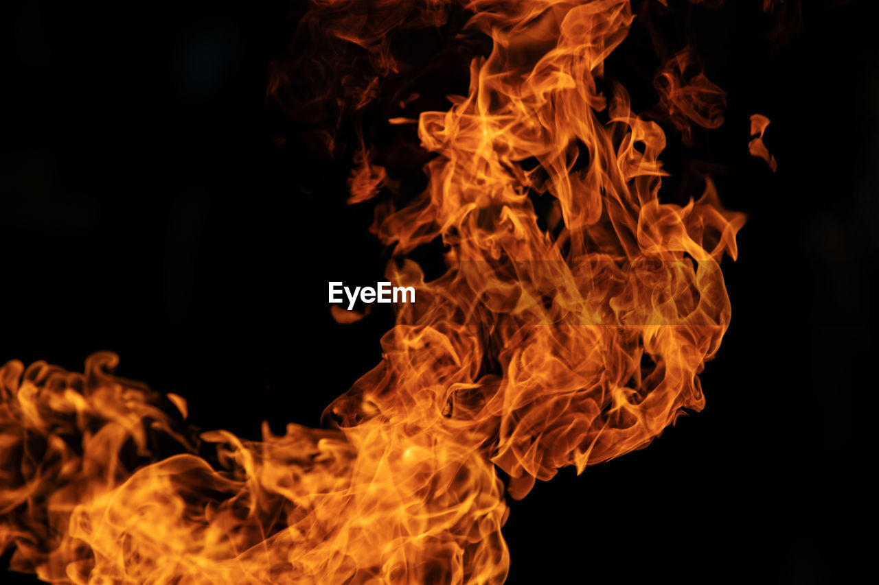 Close-up of fire against black background