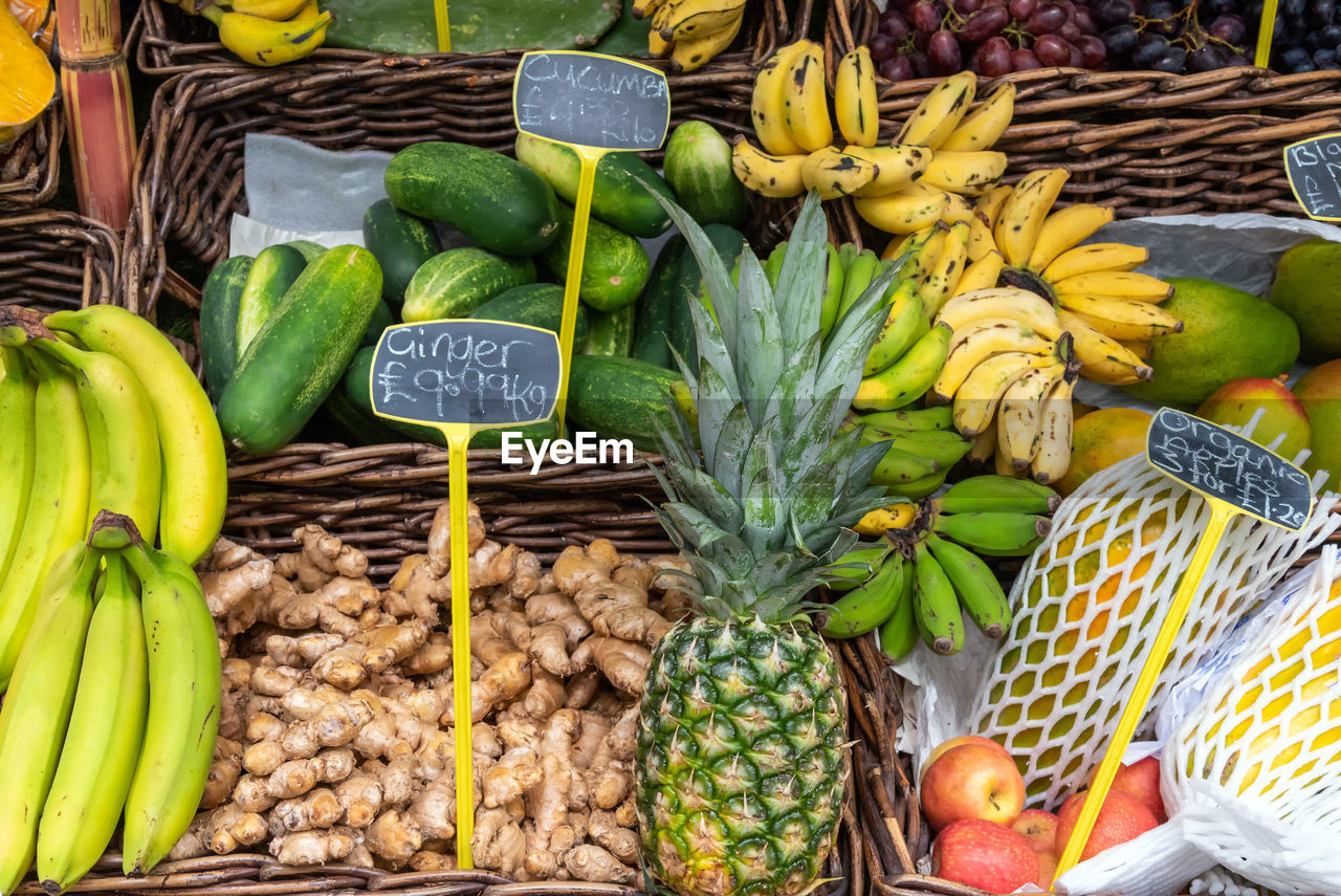 Ginger and tropical fruits for sale at a market in london