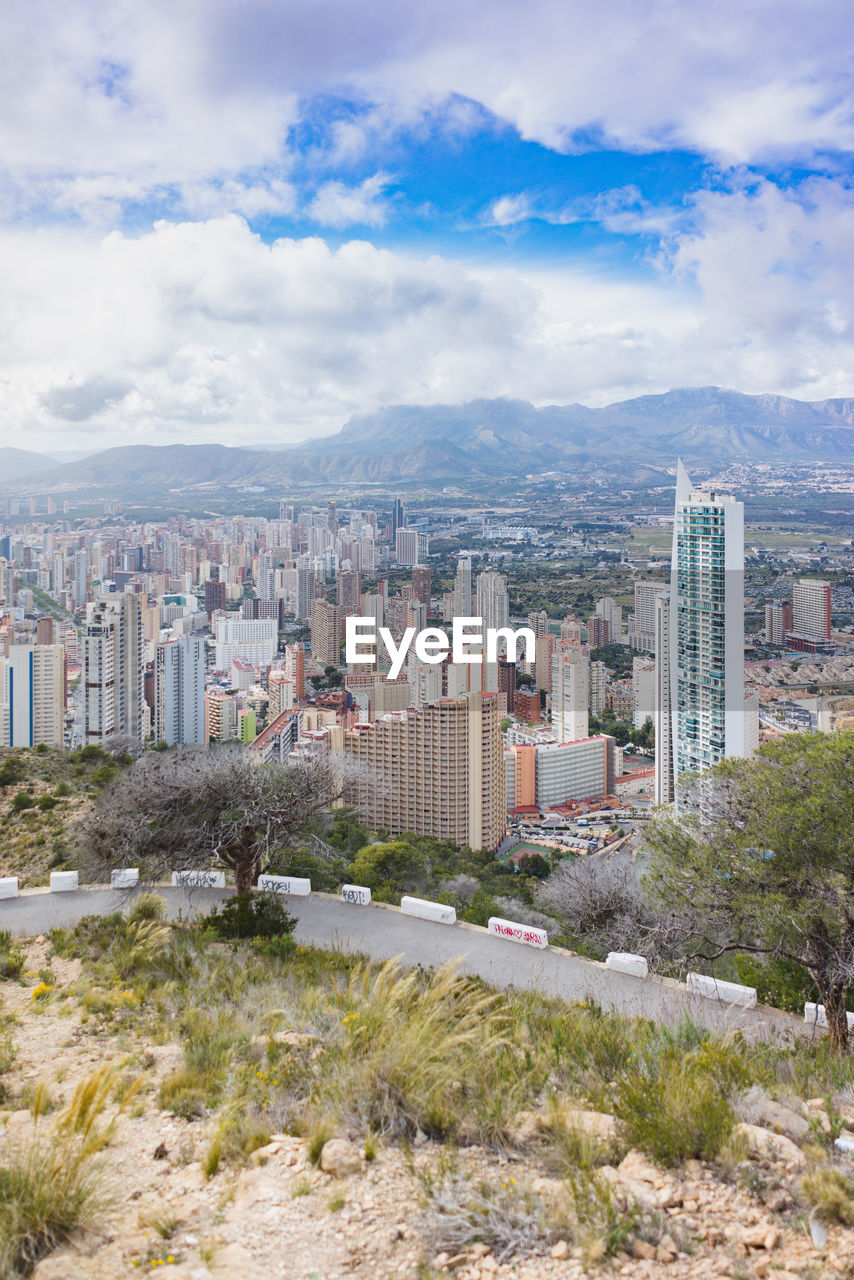 High angle view of buildings in city against sky