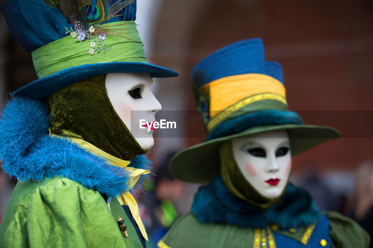 Man and woman in costume during venice carnival