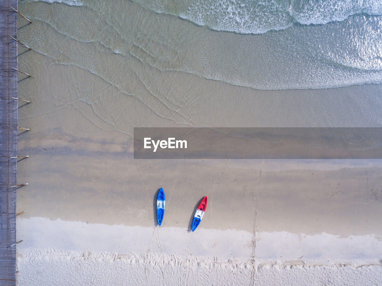 Aerial view of boats moored on shore at beach