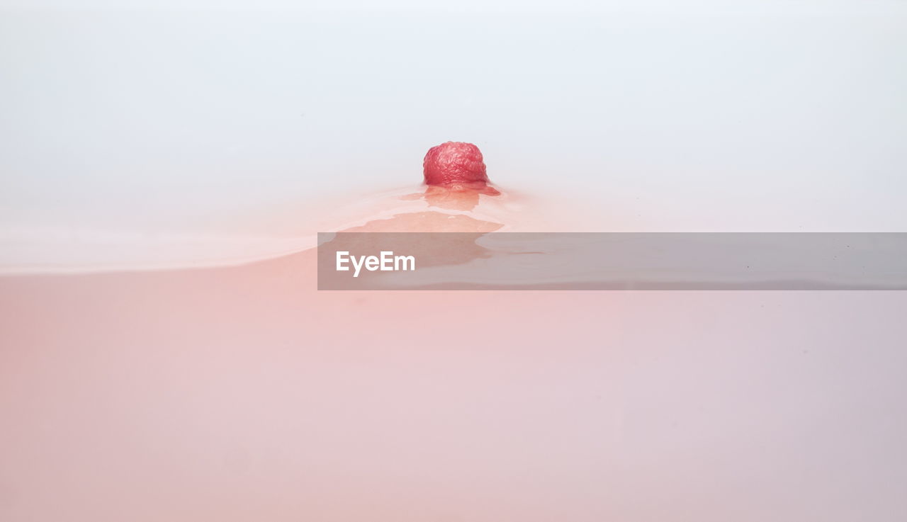 Close-up of woman nipple in bathtub