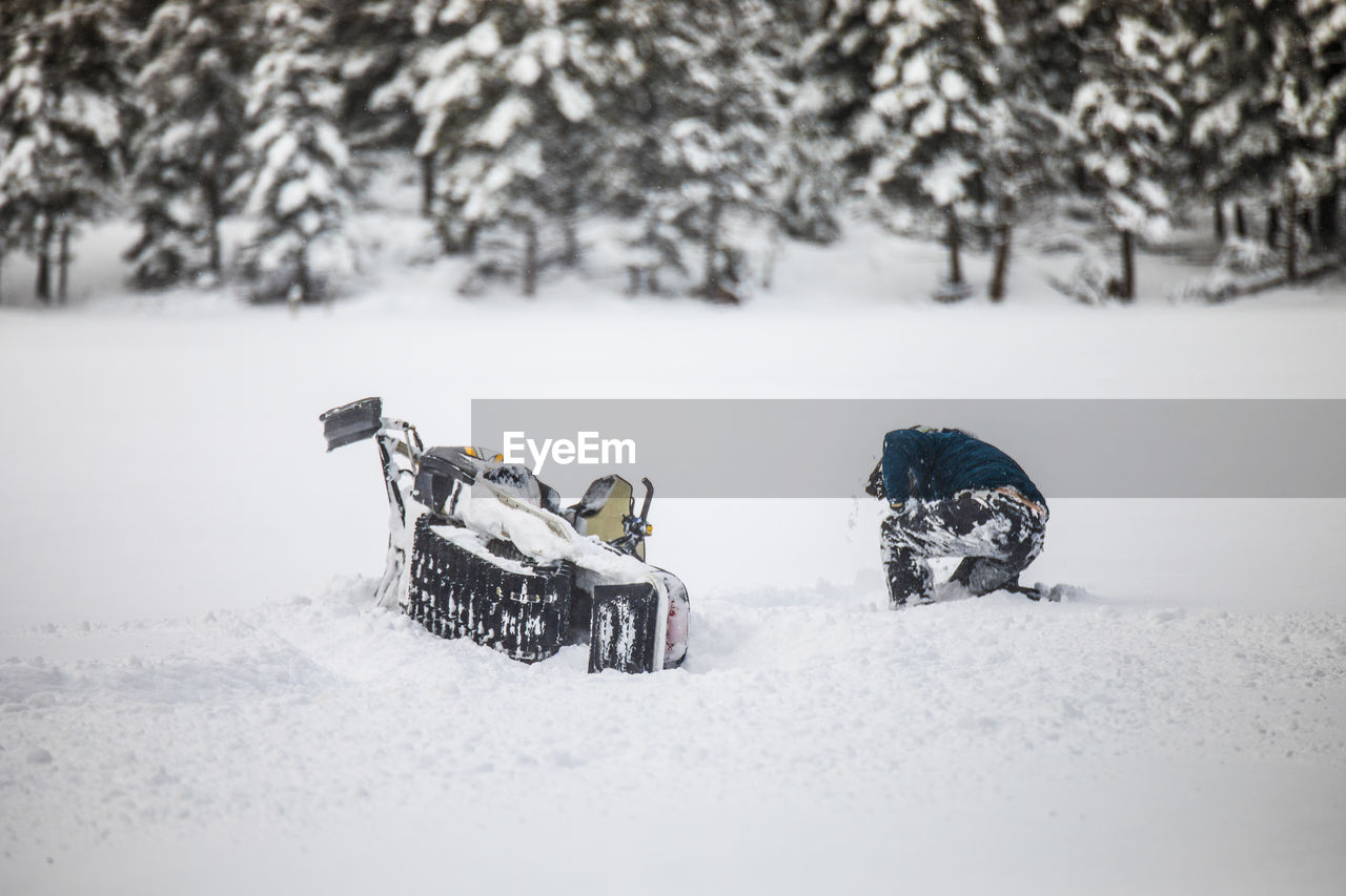 Snowmobiler crashes his sled during failed high-speed stunt