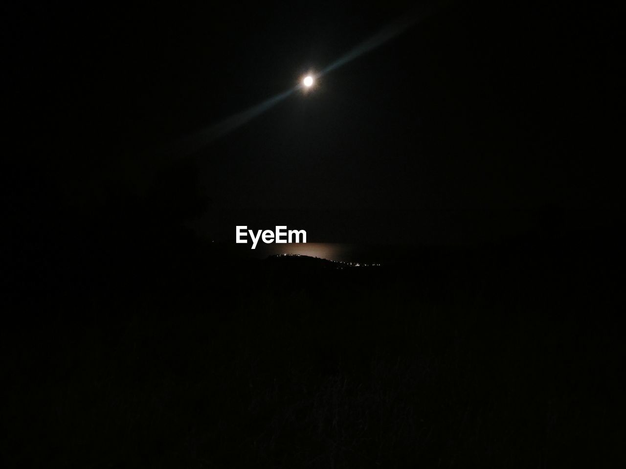 SILHOUETTE OF MOON AT NIGHT