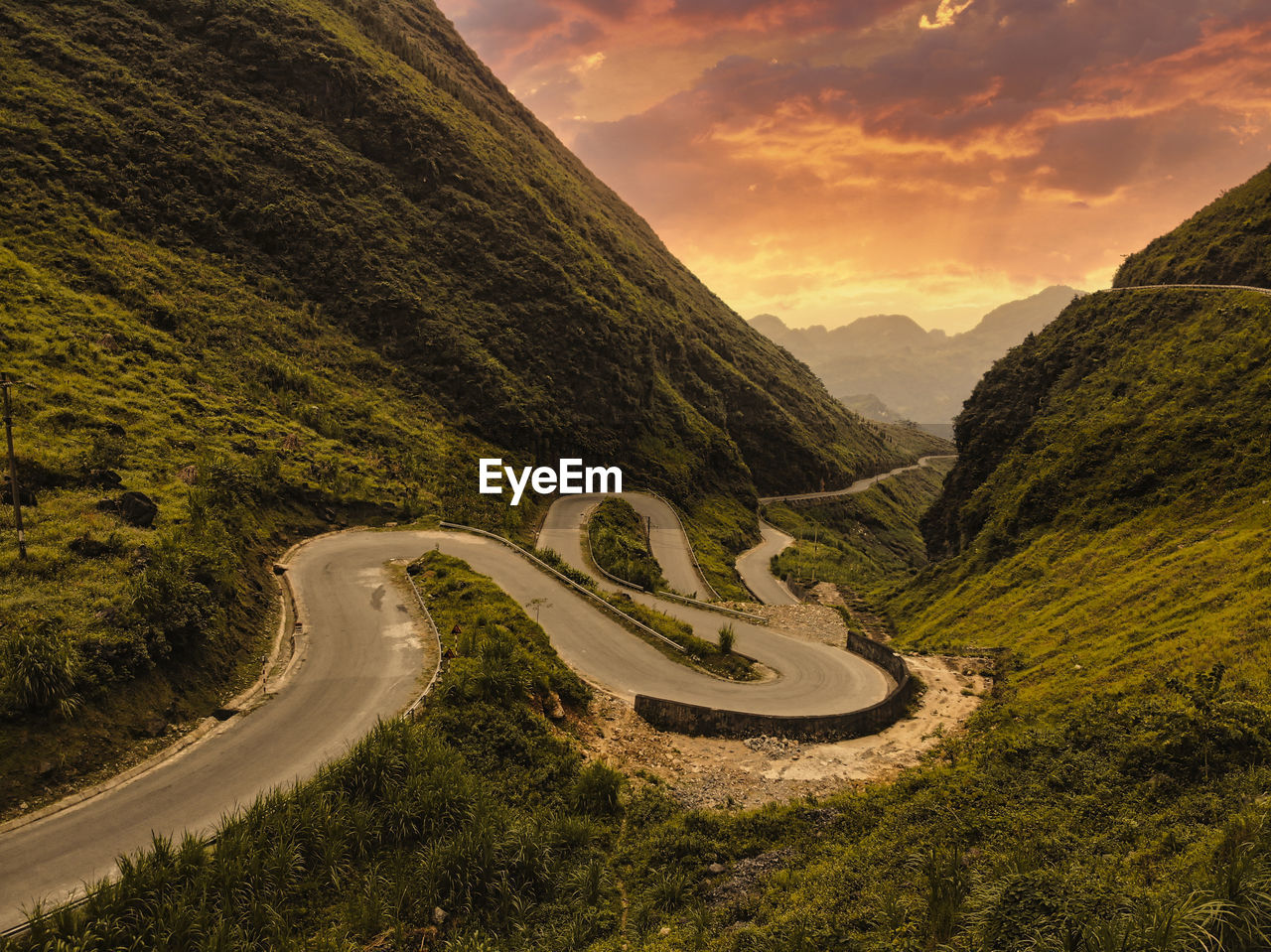 Scenic view of mountain road against sky