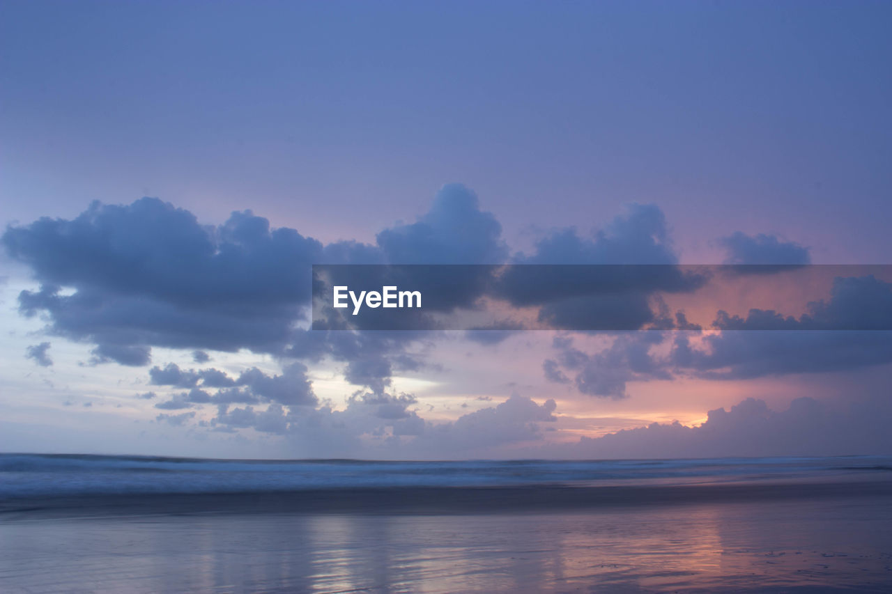 Scenic view of sea against sky at sunset
