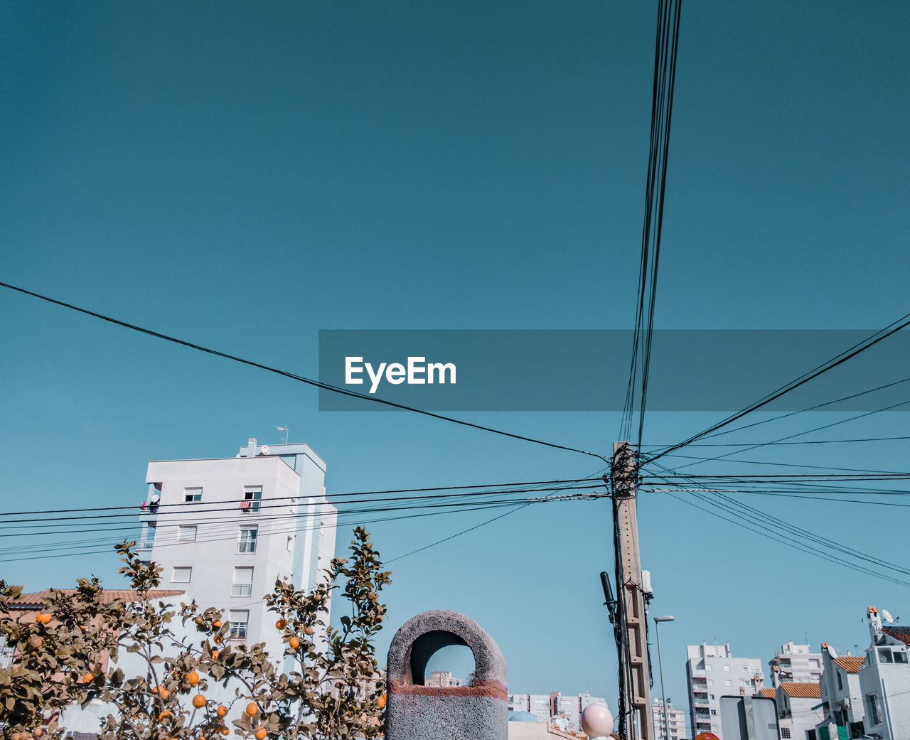 LOW ANGLE VIEW OF CABLES AGAINST SKY