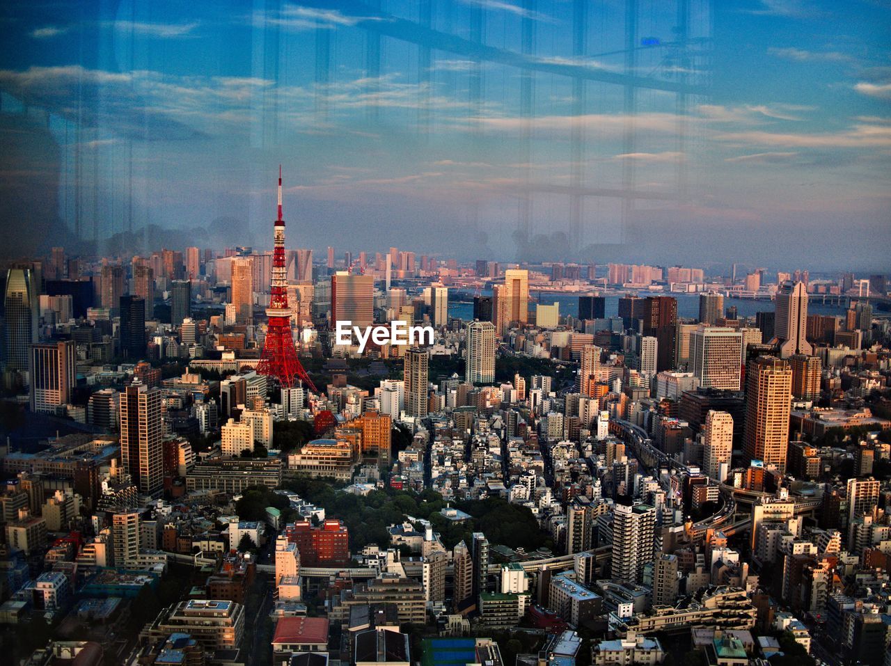 Aerial view of modern buildings in city against sky