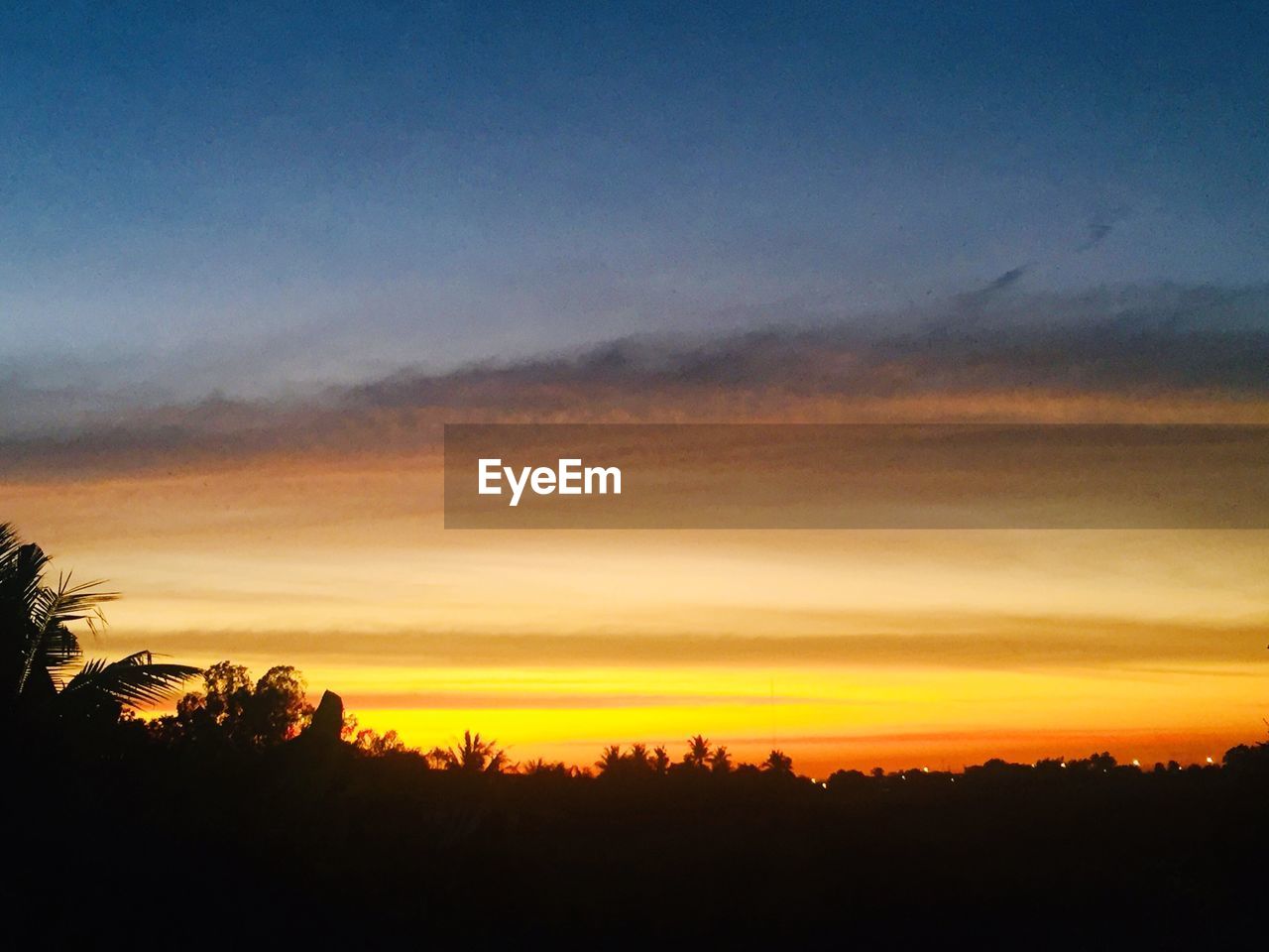 SCENIC VIEW OF SILHOUETTE LANDSCAPE AGAINST DRAMATIC SKY