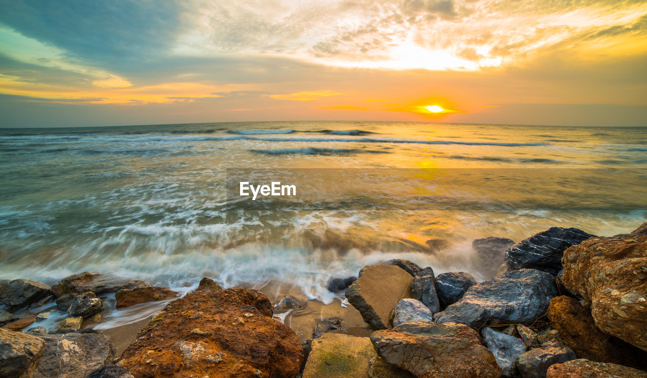 Scenic view of sea against sky during sunset