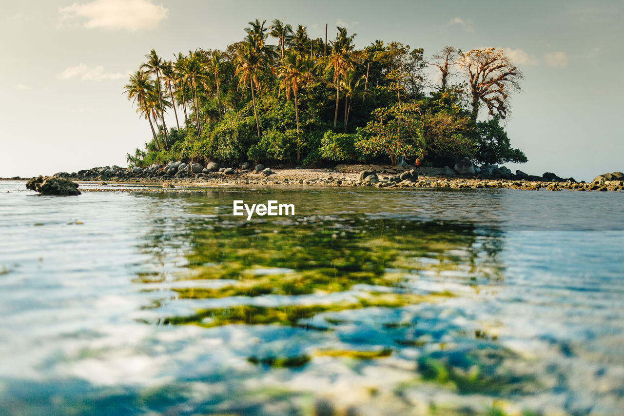 Tiny colorful island with transparent sea. koh pling, phuket thailand.