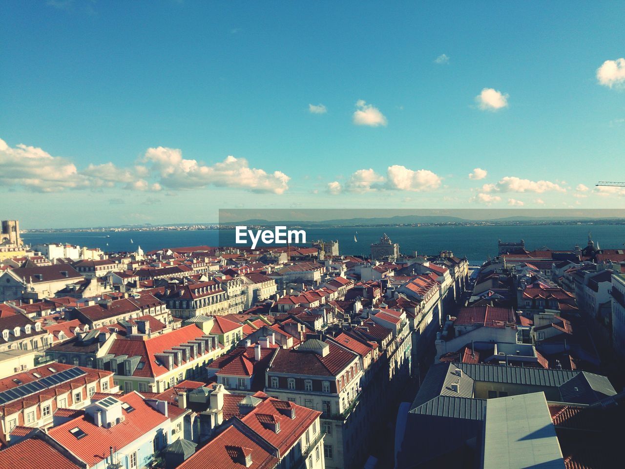 High angle view of city against cloudy sky