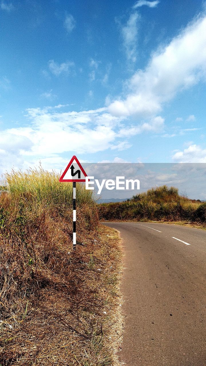 Road sign against clear sky