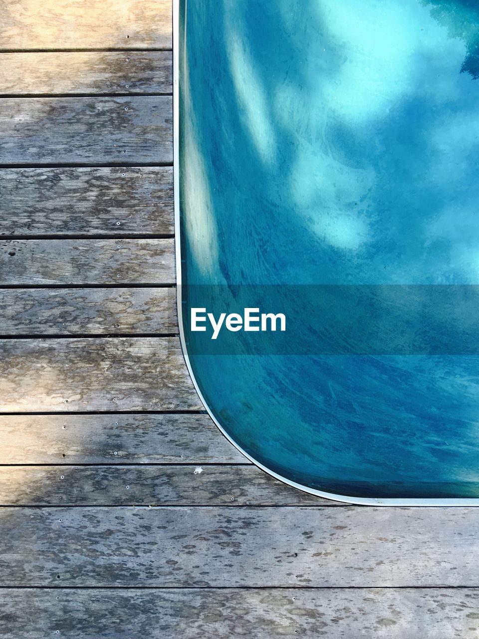Wooden posts in calm blue sea