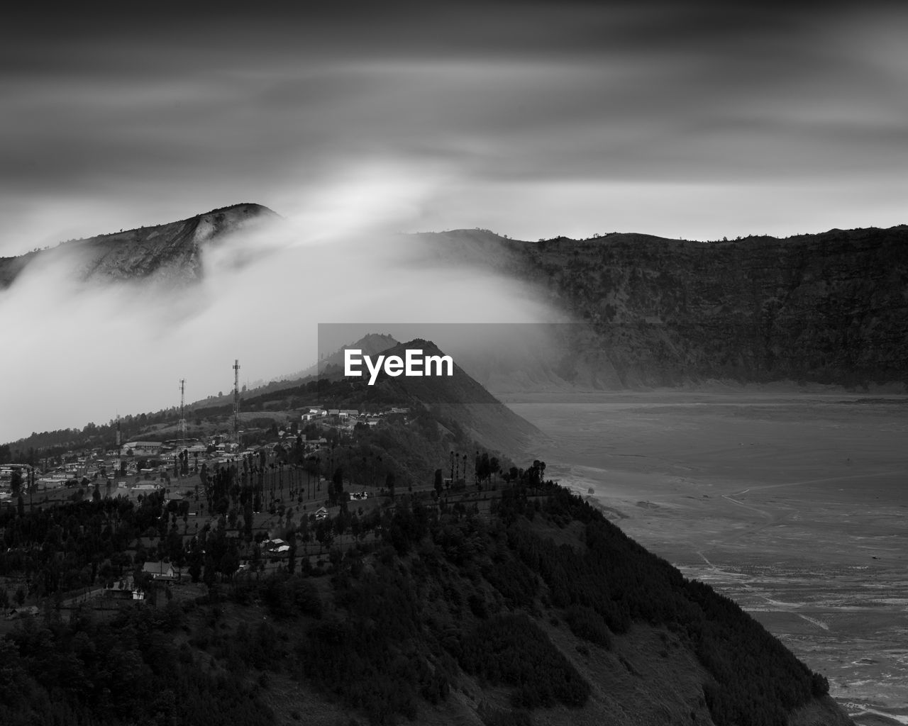 Scenic view of mountains against cloudy sky