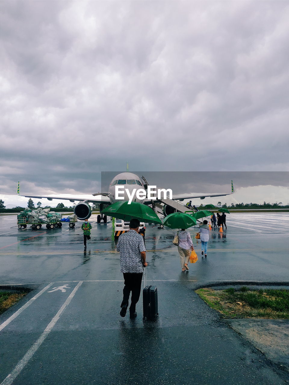 Passengers who want to ride an airplane when the weather is raining.