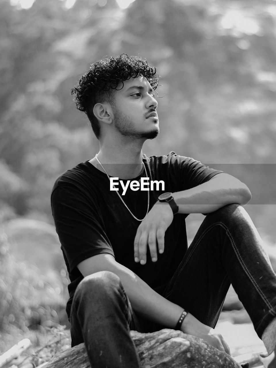 Young man looking away outdoors